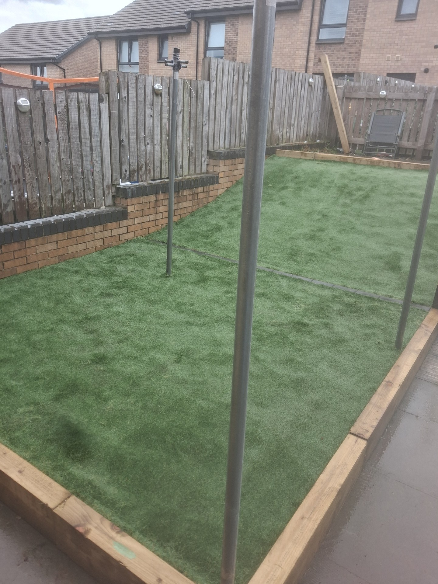 Artificial grass with sleeper edging